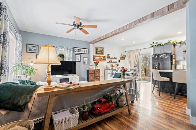 living room featuring recessed lighting, ceiling fan, and wood finished floors