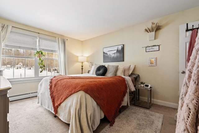 bedroom with baseboards, light carpet, and baseboard heating