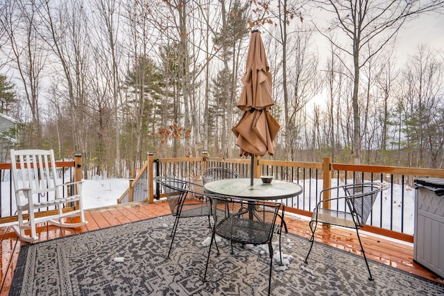 wooden deck with outdoor dining space