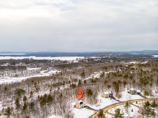 snowy aerial view with a mountain view