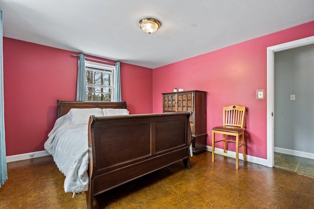 bedroom featuring baseboards