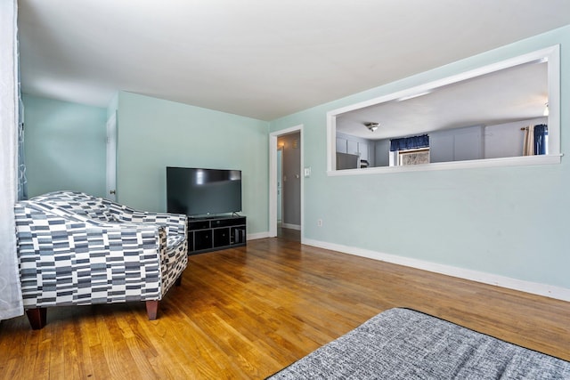 living room featuring wood finished floors and baseboards