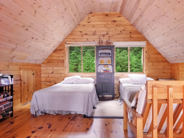 bedroom featuring lofted ceiling, wood ceiling, wooden walls, and hardwood / wood-style flooring