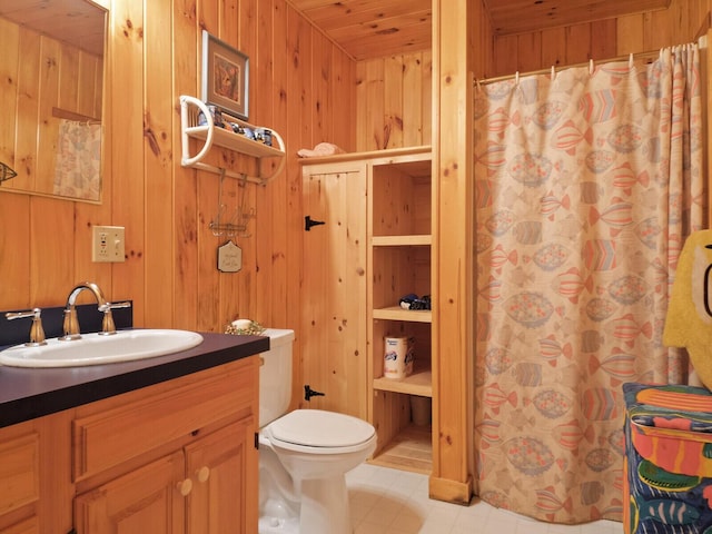 full bathroom featuring curtained shower, wooden walls, toilet, and vanity