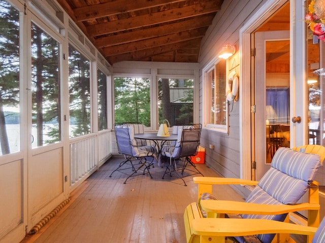 sunroom with vaulted ceiling and a wealth of natural light