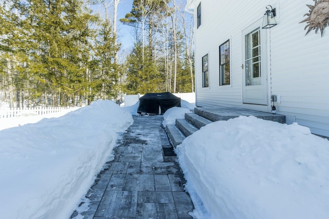 yard covered in snow with fence