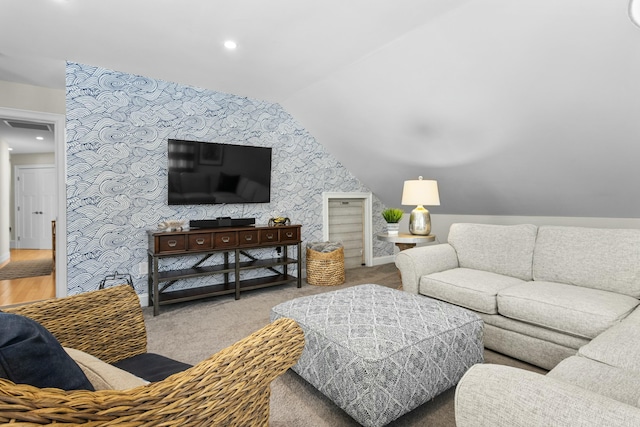 carpeted living area featuring lofted ceiling, visible vents, and recessed lighting