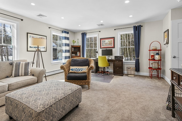 interior space featuring baseboards, visible vents, light colored carpet, a baseboard heating unit, and recessed lighting