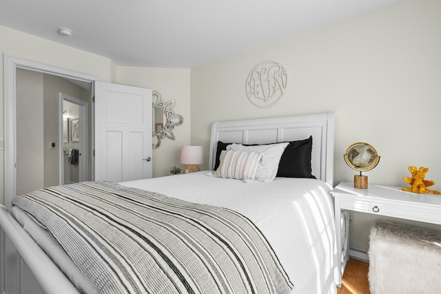 bedroom with wood finished floors