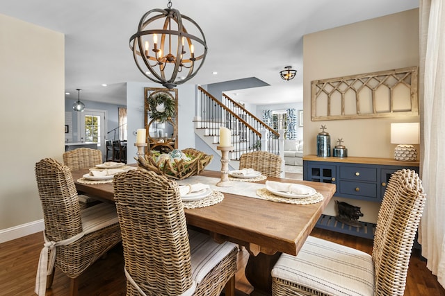 dining space featuring a chandelier, recessed lighting, baseboards, stairway, and dark wood finished floors