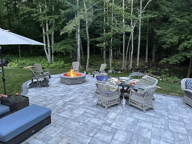 view of patio / terrace featuring an outdoor fire pit