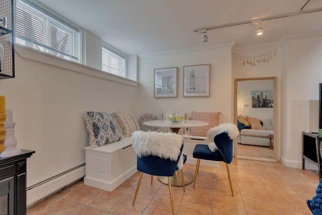 dining space with a baseboard radiator, breakfast area, crown molding, and light tile patterned flooring