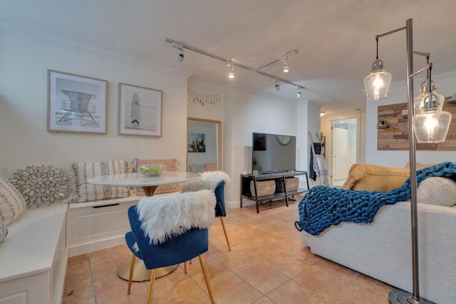 living area with ornamental molding and light tile patterned floors