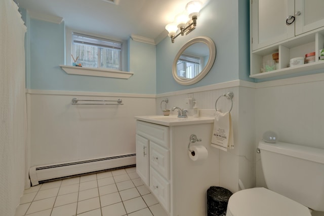 bathroom featuring plenty of natural light, wainscoting, toilet, a baseboard radiator, and tile patterned floors