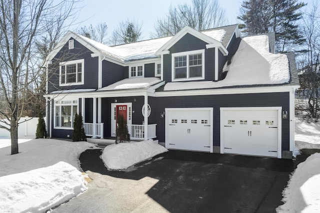 traditional home with covered porch and driveway