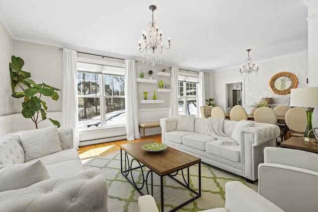 living room featuring a baseboard heating unit, a notable chandelier, wood finished floors, and ornamental molding