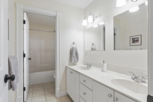 full bathroom featuring tile patterned flooring, shower / washtub combination, double vanity, and a sink