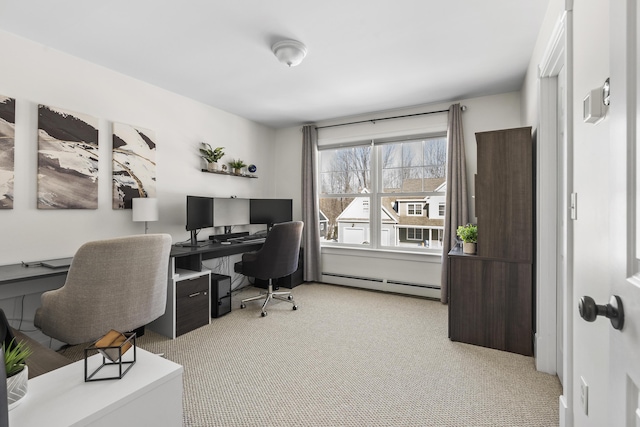 home office featuring a baseboard radiator and carpet