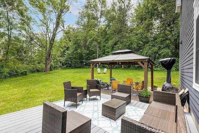 wooden deck featuring a gazebo, a lawn, and outdoor lounge area