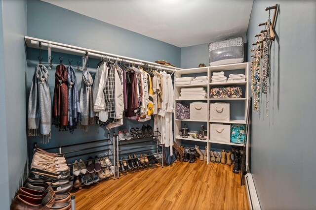 271 Red Gate Ln, Acton, ME 04001 - walk in closet with wood finished floors and a baseboard heating unit