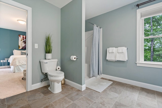 271 Red Gate Ln, Acton, ME 04001 - bathroom with a shower with shower curtain, ensuite bathroom, and stone finish flooring