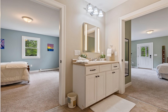 271 Red Gate Ln, Acton, ME 04001 - ensuite bathroom with a baseboard heating unit, vanity, and plenty of natural light