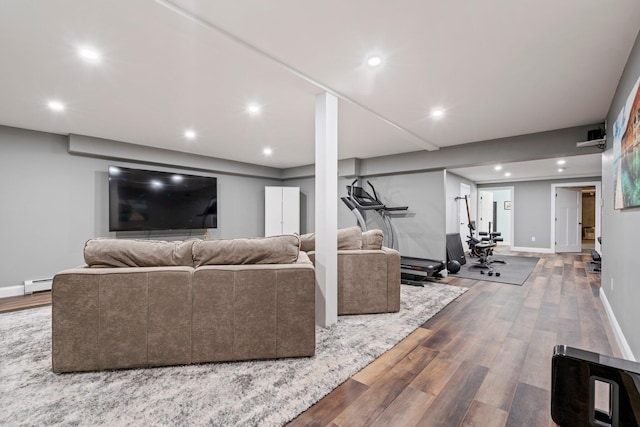 271 Red Gate Ln, Acton, ME 04001 - living room with wood finished floors, a baseboard radiator, and recessed lighting