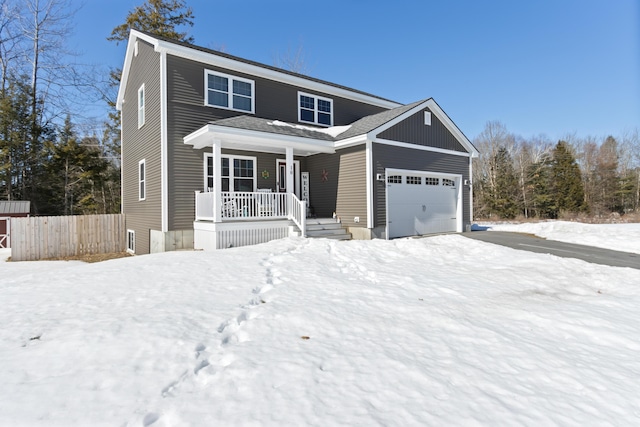 view of front of property featuring a porch, an attached garage, and fence