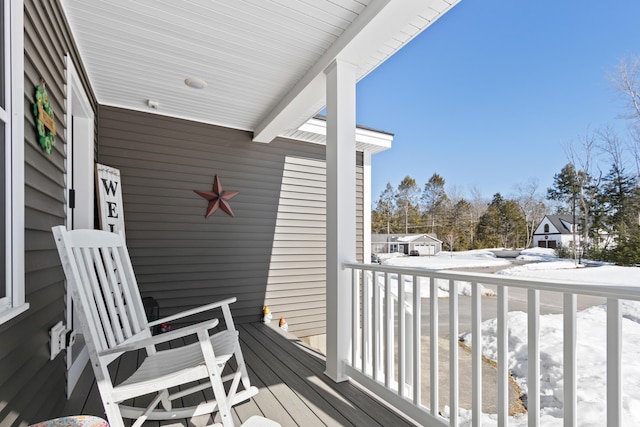 view of snow covered deck