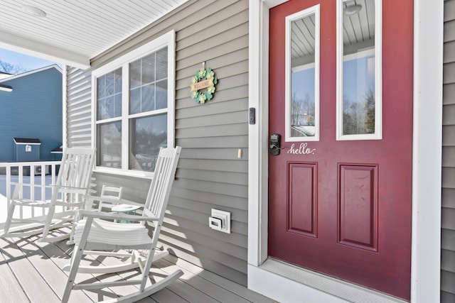 property entrance with covered porch