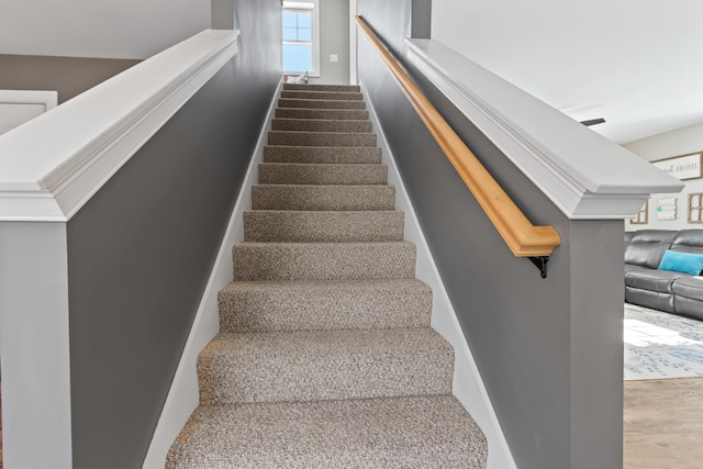 stairs with wood finished floors