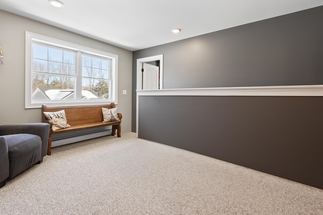 living area featuring a baseboard radiator, carpet flooring, and recessed lighting