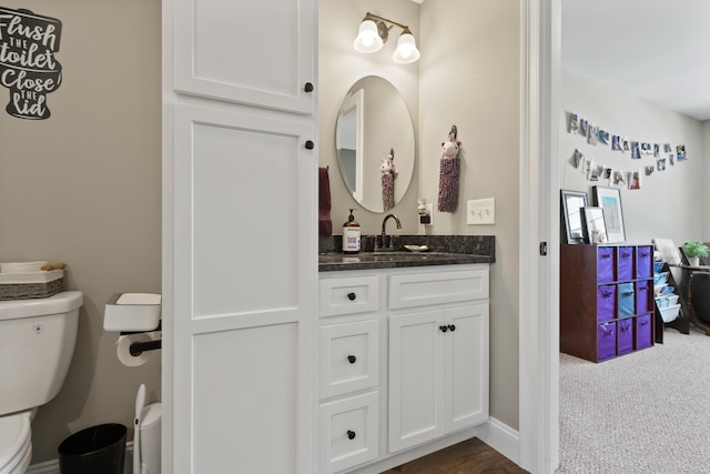 bathroom with vanity and toilet