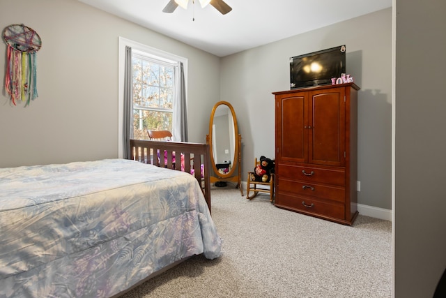 bedroom with ceiling fan, baseboards, and light colored carpet