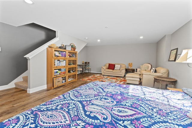 interior space featuring baseboards, wood finished floors, and recessed lighting