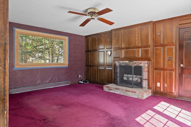 unfurnished living room featuring a ceiling fan, carpet flooring, a brick fireplace, and baseboard heating
