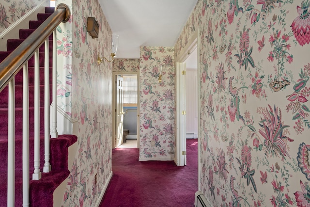 corridor featuring wallpapered walls, baseboards, carpet, and a baseboard radiator