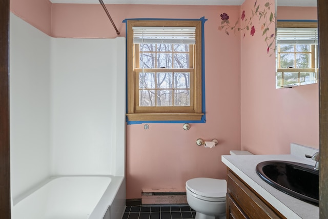 full bath with walk in shower, tile patterned flooring, vanity, toilet, and a tub