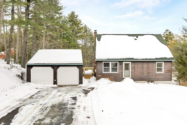 view of front of home featuring a garage and a chimney