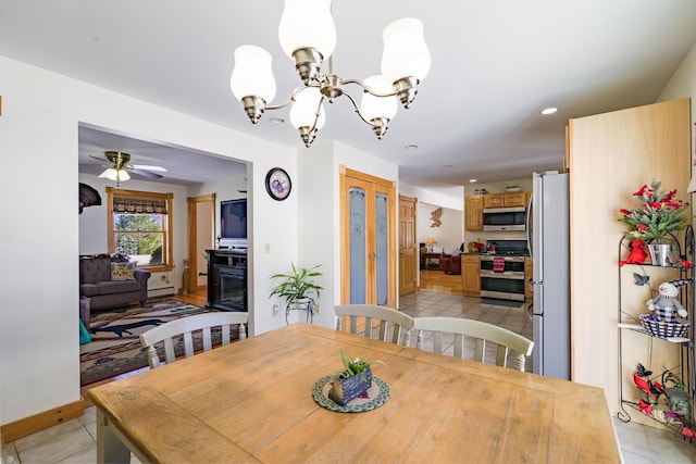 dining area featuring light tile patterned flooring, a baseboard radiator, recessed lighting, ceiling fan with notable chandelier, and baseboards