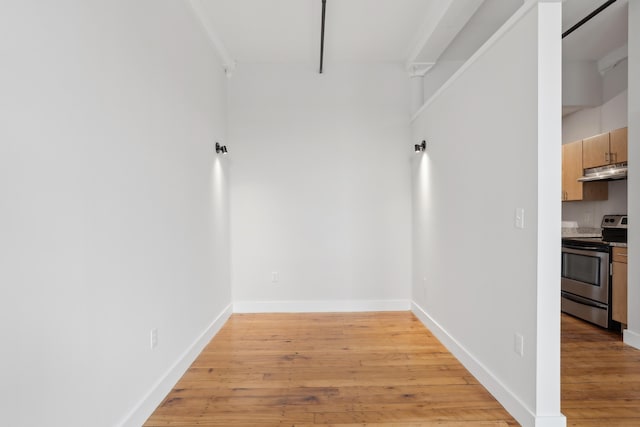 interior space with light wood-type flooring and baseboards