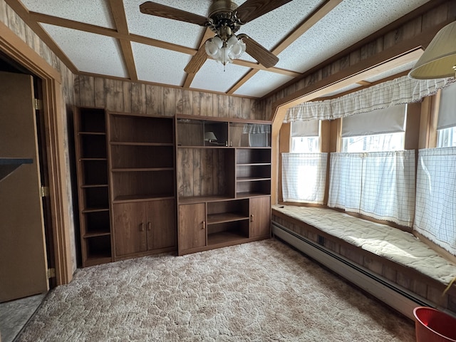 143 Main St, Sangerville, ME 04479 - unfurnished room with a baseboard heating unit, a ceiling fan, carpet floors, and wood walls