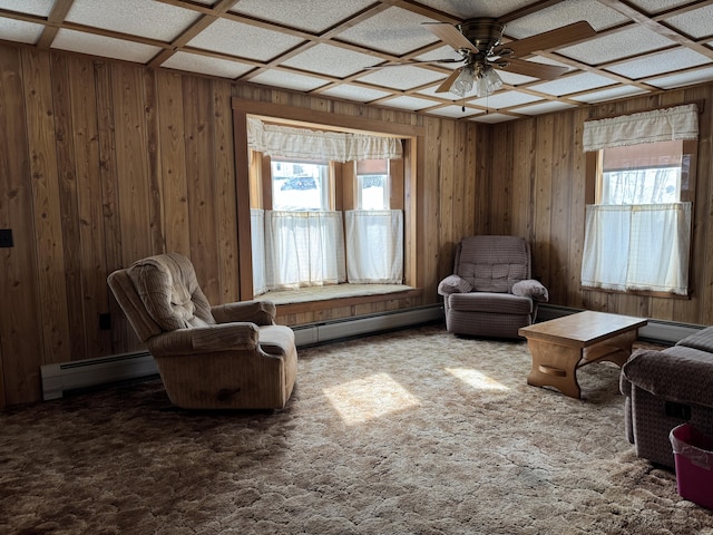 143 Main St, Sangerville, ME 04479 - living area featuring baseboard heating, a ceiling fan, carpet, and wooden walls