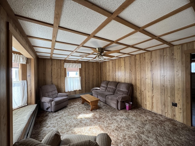143 Main St, Sangerville, ME 04479 - living room featuring carpet, ceiling fan, wood walls, a baseboard radiator, and coffered ceiling