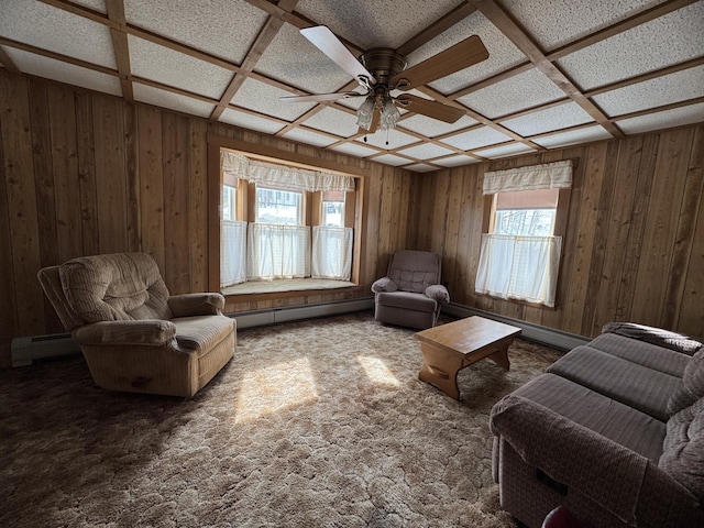 143 Main St, Sangerville, ME 04479 - sitting room featuring a baseboard heating unit, healthy amount of natural light, ceiling fan, wooden walls, and carpet floors