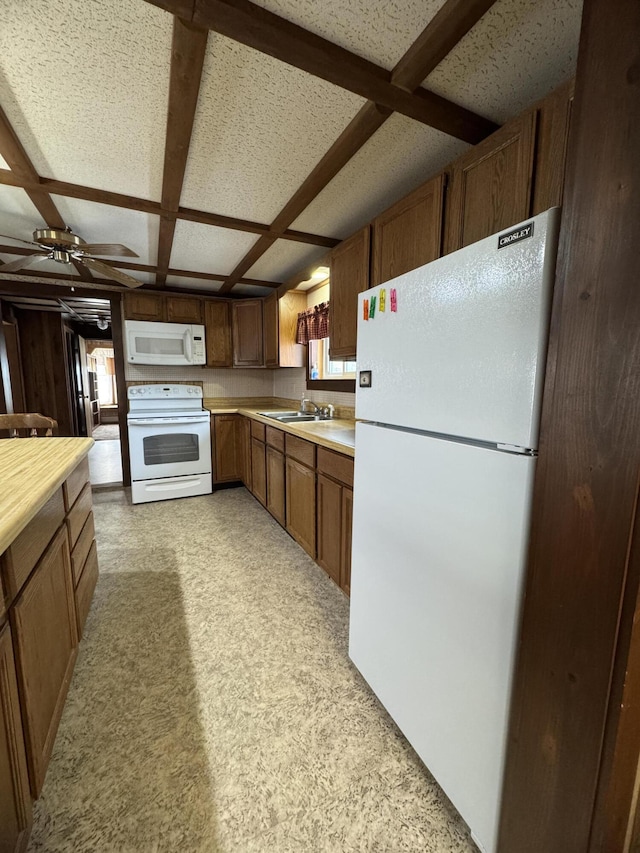 143 Main St, Sangerville, ME 04479 - kitchen with white appliances, light countertops, coffered ceiling, a sink, and ceiling fan