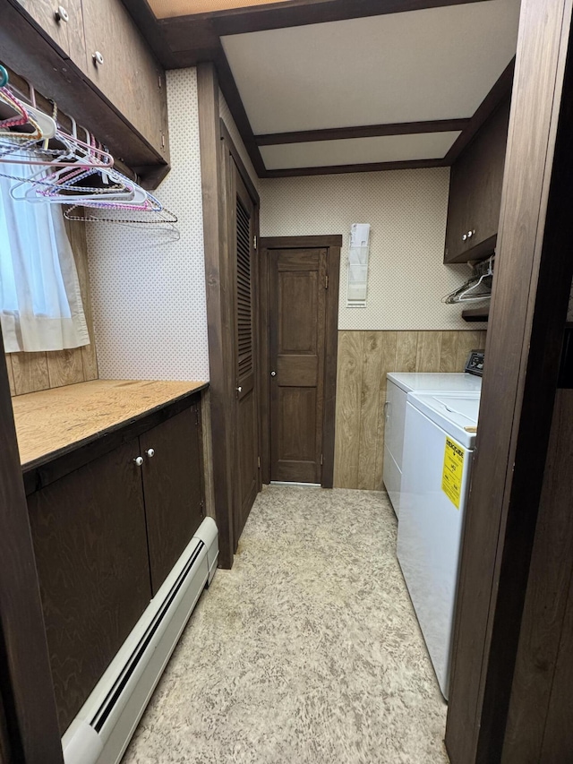 143 Main St, Sangerville, ME 04479 - laundry area with baseboard heating, independent washer and dryer, and cabinet space