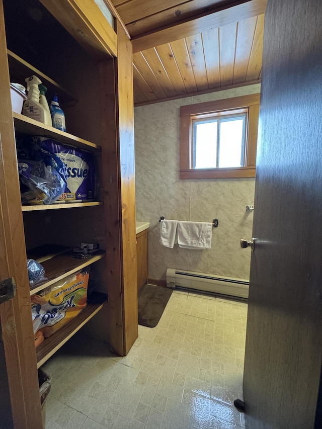 143 Main St, Sangerville, ME 04479 - bathroom featuring a baseboard radiator and wood ceiling