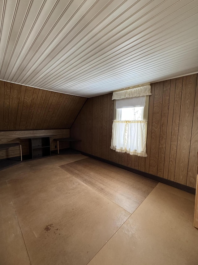 143 Main St, Sangerville, ME 04479 - additional living space with concrete floors, wood walls, and wooden ceiling