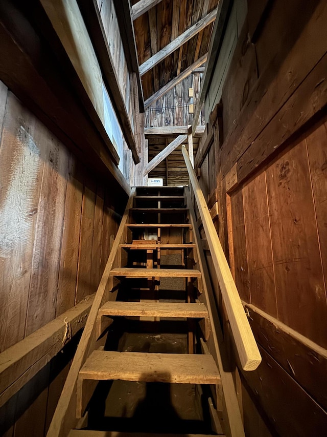 143 Main St, Sangerville, ME 04479 - staircase featuring wood walls